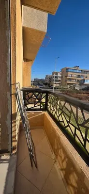 a balcony with a metal railing on a building at luxury apartment DT2 in Mohammedia