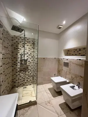 a bathroom with a sink and a toilet and a shower at Appartement spacieux tout confort in Casablanca