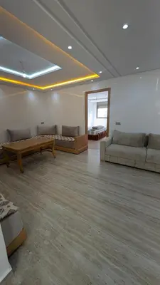 a large living room with couches and a table at appartement en bord de mer Rabat in Rabat