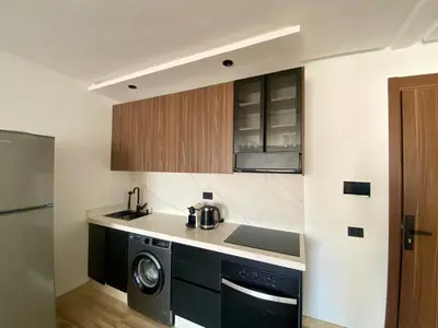 a kitchen with a sink and a washing machine at Welcome Stay Centre Casa Gares &Tram in Casablanca