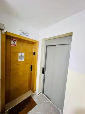 a room with two doors and a tile floor at Elegant house for you in Ain Sebaa 4 in Casablanca