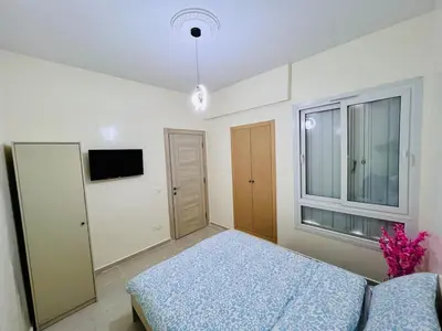 a bedroom with a bed and a window at Elegant house for you in Ain Sebaa 4 in Casablanca