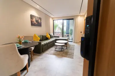 a living room with a couch and a table at Modern & chic studio in Anfa Park, Fast Wifi in Casablanca