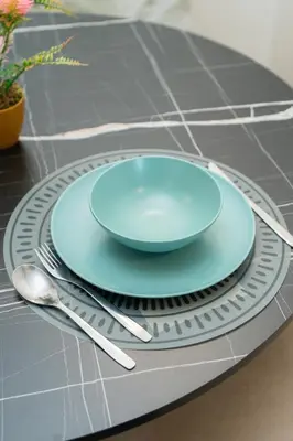a blue plate on a table with silverware at Modern & chic studio in Anfa Park, Fast Wifi in Casablanca