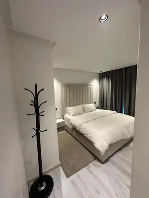 a bedroom with a large white bed and aitiousitiousitious at High standing 2 bedroom apartment in Casablanca