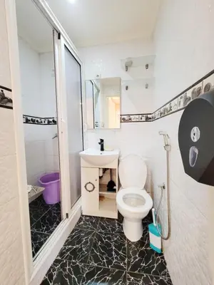 a bathroom with a toilet and a sink at 7 min to beach luxury apartment Dar Bouazza in Casablanca