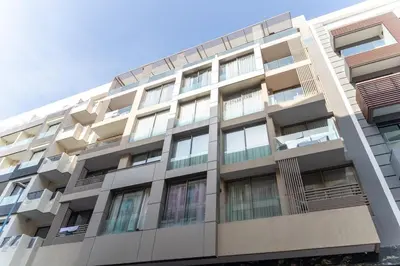 an apartment building with balconies on the side at Peaceful Haven for a Quiet Stay in Maarif 500m to Mohamed Stadium in Casablanca