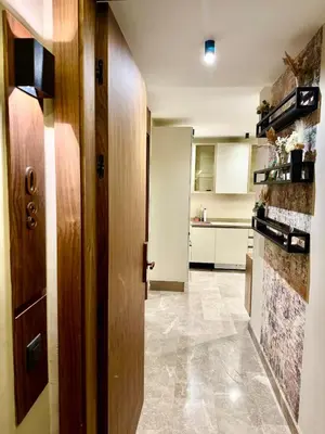 a kitchen with a hallway with a door and a stove at SALVia Loft - Sweetness and Cozy Apartment with Terrace Near Mohammed V Stadium in Casablanca