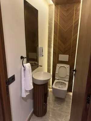 a small bathroom with a sink and a toilet at HERBA Studio - Cozy Space with an Unobstructed View in Bourgogne in Casablanca