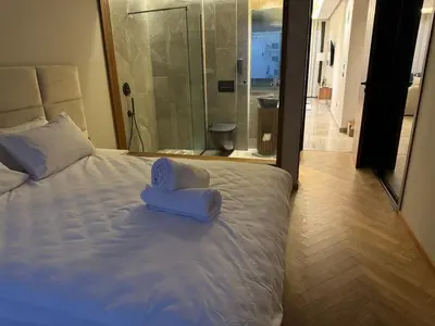 a bed with a pair of blue towels on it at HERBA Studio - Cozy Space with an Unobstructed View in Bourgogne in Casablanca