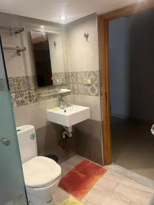 a bathroom with a toilet and a sink at Toute commodité in Casablanca