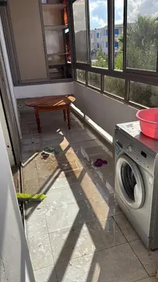 a laundry room with a washing machine and a window at Appartement Marbella beach in Mansouria