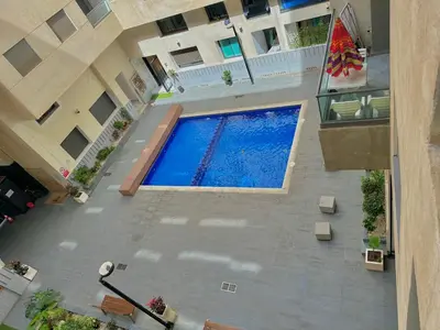 an overhead view of a swimming pool in a building at Modern Comfort Studio, la corniche in Mohammedia