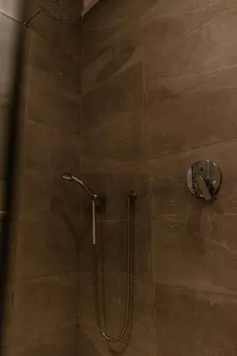 a shower in a bathroom with a glass door at APGCI-Elegant studio sur Ferme bretonne in Casablanca