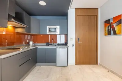 a kitchen with a sink and a refrigerator at APGCI-Elegant studio sur Ferme bretonne in Casablanca