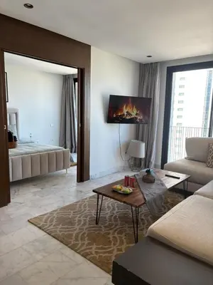 a living room with a couch and a fireplace at Cosy Studio at B-Living Casa Port Ideal for Business & City Trips with Open View Heart Of Casablanca in Casablanca