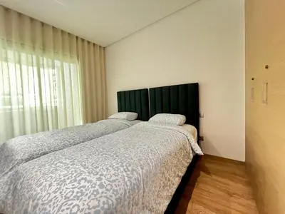 two beds sitting next to each other in a bedroom at Urban Chic 2BR - Prestigia near stadium in Rabat