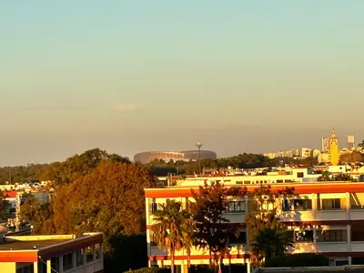 a view of a city with buildings and trees at Appartement moderne aux perles de temara in Temara