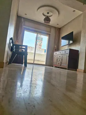 an empty room with a kitchen with a large window at Grande appartement 4 chambre in Casablanca