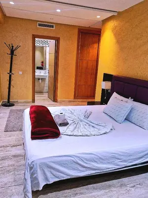 a bedroom with a large white bed in a room at Grande appartement 4 chambre in Casablanca