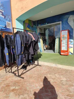 a rack of shirts in front of a store at Eco Gare centre 2 chambres in Bouznika