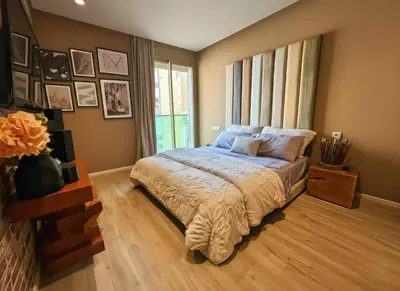 a bedroom with a bed and a large window at Maya Suites - Luxury Stay in Casablanca in Casablanca
