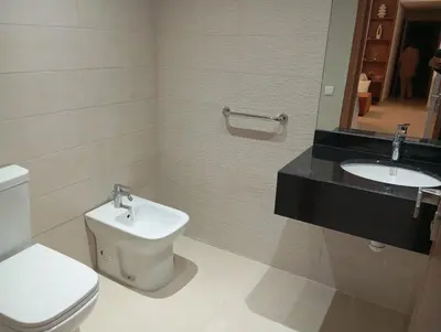 a bathroom with a toilet and a sink at Ennour in Rabat