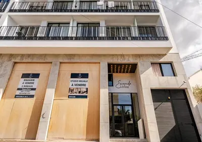 a building with signs on the front of it at Studio Luxe avec vue Magnifique WiFi Haut Debit et Netflix Inclus in Casablanca