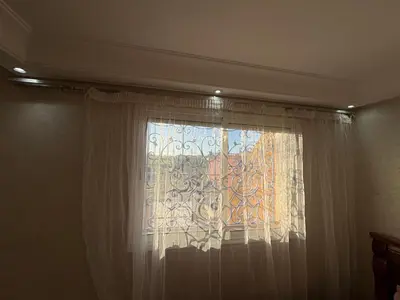a curtain on a window in a room at VILLA Dar BOUAZZA, Vue sur mer, 200m de la plage in Dar Bouazza