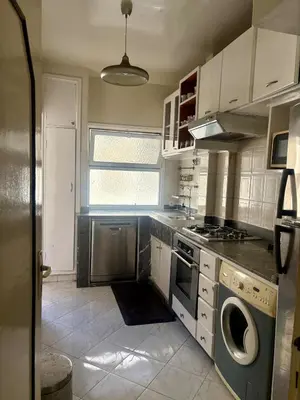 a kitchen with a stove and a dishwasher at Apartment in Agdal, 3-min walk from Arribat Center in Rabat