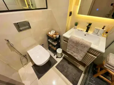 a small bathroom with a toilet and a sink at Maya Suites - Seaside Luxury Apartment in Casablanca
