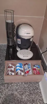 a coffee maker and a blender on a table at well-equipped apartment in Mansouria