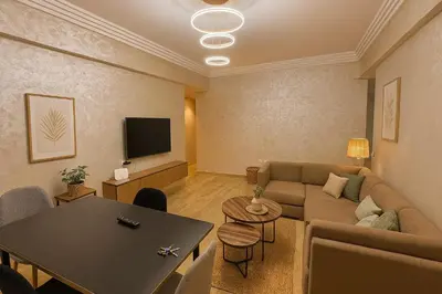 a living room with a couch and a table at Appartement vue sur mer 3 chambres in Rabat