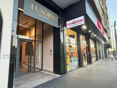 a store front of a store with signs on it at Maya Suites - Oasis Casablanca in Casablanca