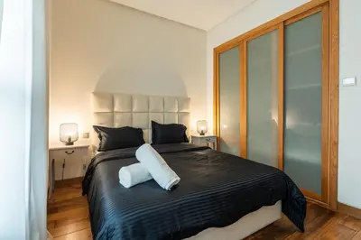 a bedroom with a bed with a white pillow on it at C08- Anfa Place Luxury Apartment - Beach Access in Casablanca