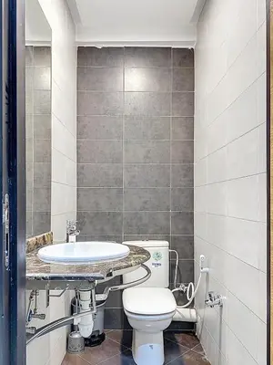 a bathroom with a toilet and a sink at Appartement Typique Marocain in Oulad Akkou