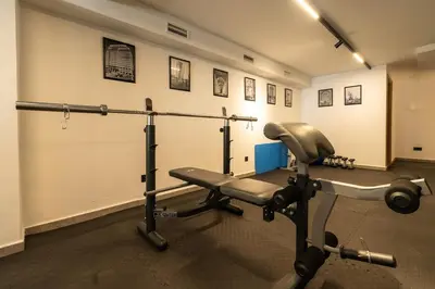 a room with a gym with a bench and weights at C13 - 1BR Suite - Private Gym - Terrace - Rooftop in Maarif