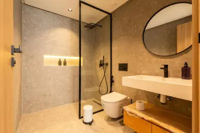 a bathroom with a shower and a toilet and a sink at C13 - 1BR Suite - Private Gym - Terrace - Rooftop in Maarif