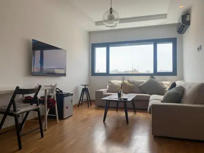 a living room with a couch and a table at Marina, Medina et Bab Marrakech 8 min Hassan 2 in Casablanca