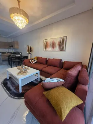 a living room with a couch and a table at Appartement in Casablanca