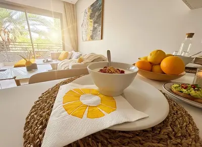 a kitchen with a bowl of food on a table at Maya Suites - Riviera B Casablanca in Casablanca