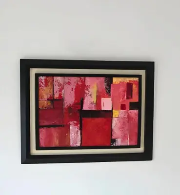 a painting of red on a white wall at Beach & Art Bungalow in El Harhoura