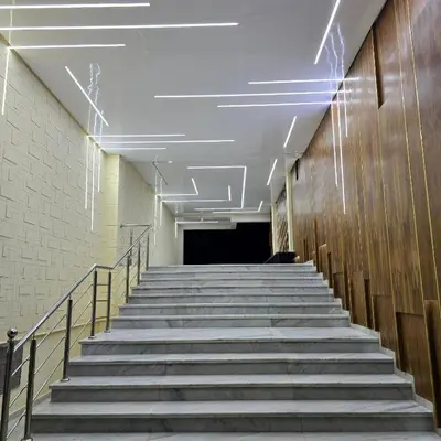 a hallway with stairs in a building at Appartement à louer Eden Mansouria Residence in Mansouria