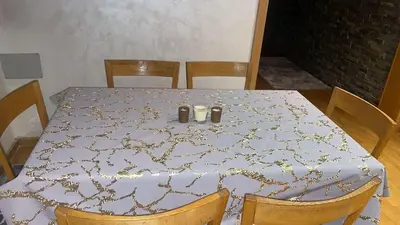 a table with two candles on top of it at Apartment luxurious a Hay Riad in Rabat