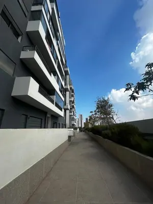 an empty sidewalk next to a building at Chic Cocoon & Impeccable Sea View in Zenata in Aïn Harrouda