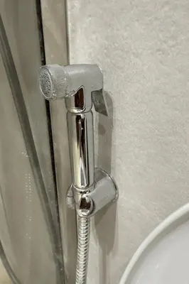 a bathroom with a toilet with a chrome handle at Cozy 2-bedroom studio in Casablanca