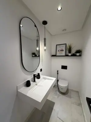 a bathroom with a sink and a mirror and a toilet at studio luxe rooftop & gym quartier des princess in Casablanca