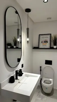 a bathroom with a sink and a mirror and a toilet at studio luxe rooftop & gym quartier des princess in Casablanca