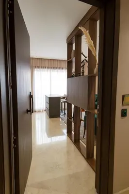 a hallway with a desk in a room at My Cosy Place Cosy Apartment Casa gare Oasis in LʼOasis