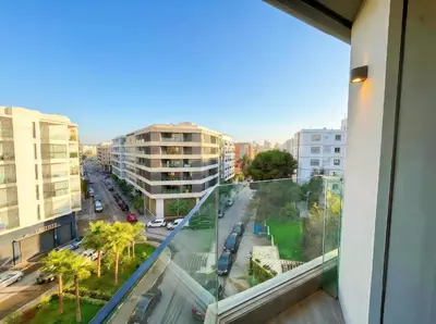 a balcony with a view of a street and buildings at Maya Suites - Mohamed V Stadium - Casablanca in Casablanca